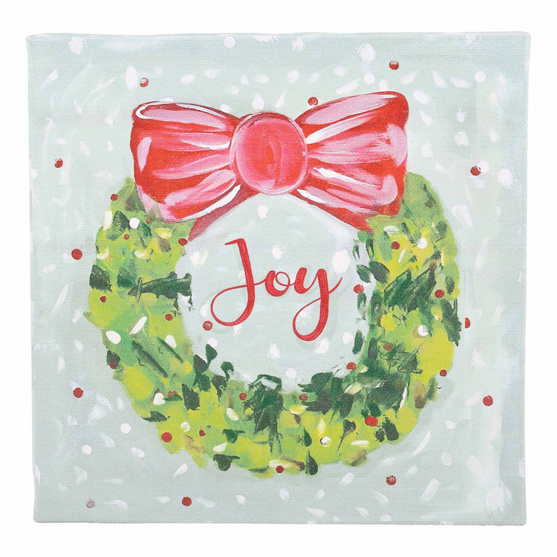 Christmas-themed canvas with a wreath, pink bow, and 'Joy' text on a light blue background.