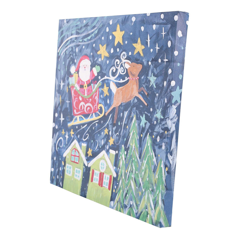 Canvas print with Christmas scene featuring Santa Claus, reindeer, and houses on a blue background.