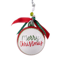 Christmas ornament with 'Merry Christmas' text and festive ribbons on a white background