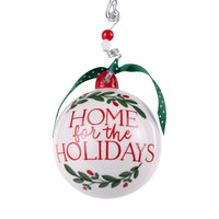 Christmas ornament with 'Home for the Holidays' text on a white background