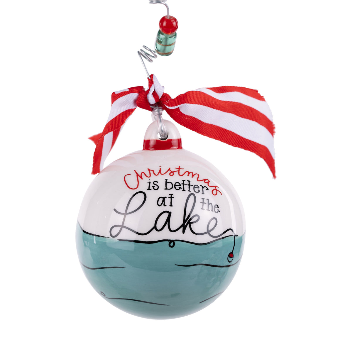 Decorative Christmas ornament with 'Christmas is better at the Lake' text and a red and white ribbon on a white background.