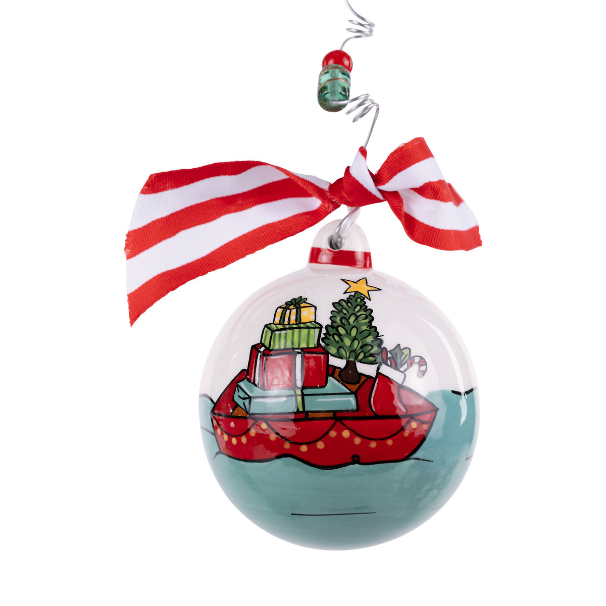 Christmas ornament with Santa Claus sleigh and reindeer design, tied with a red and white ribbon.