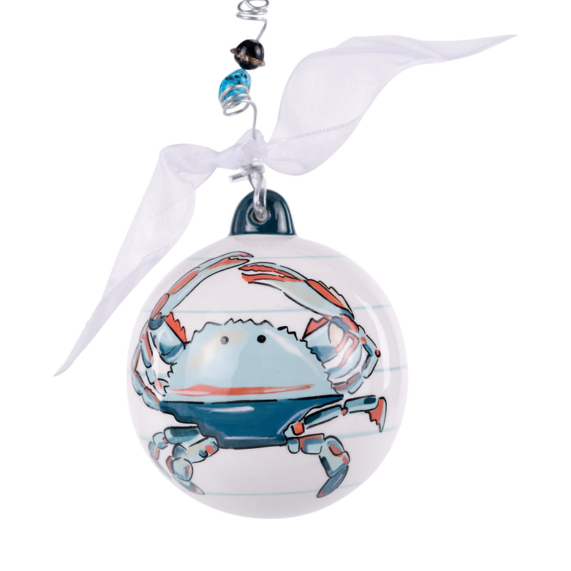 Decorative Christmas ornament with a blue crab design on a white background