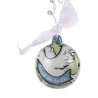 Decorative Christmas ornament with a cartoon design and 'Peace on Earth' text on a white background.