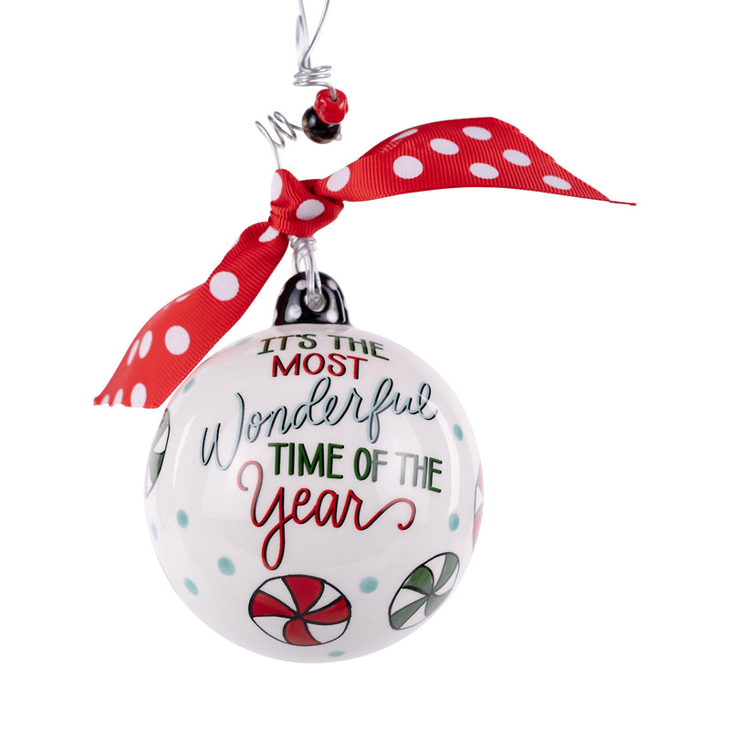 Christmas ornament with 'It's the Most Wonderful Time of the Year' text and candy cane design on a white background.