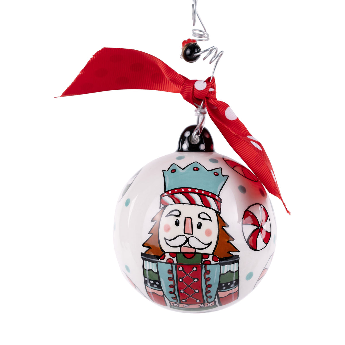Christmas ornament with a cartoon character wearing a crown and holding a candy cane, attached to a red ribbon.