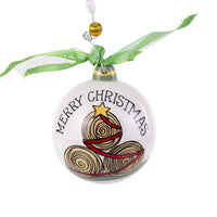 Christmas ornament with 'Merry Christmas' text and tree design on a white background