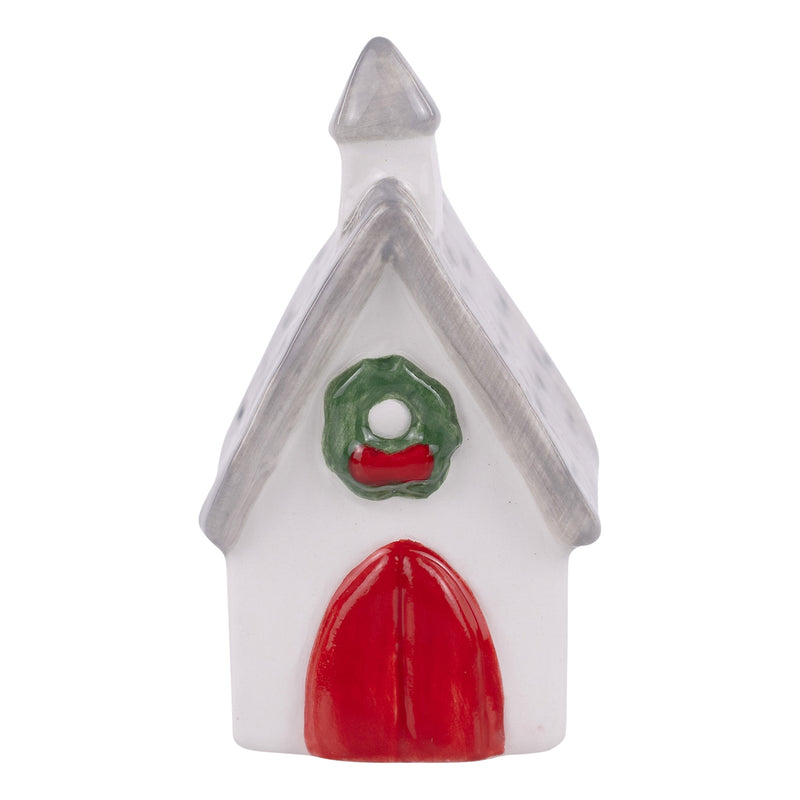 Small decorative house with a red door and green wreath on a white background