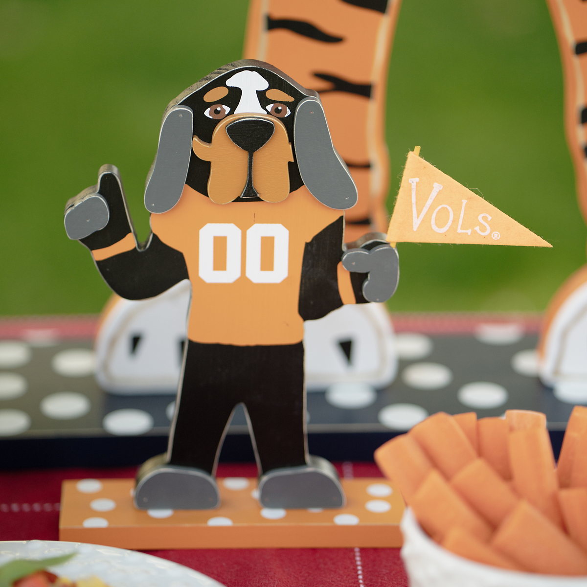 University of Tennessee tabletop décor featuring Smokey holding a Vols flag and wearing a Tennessee jersey.