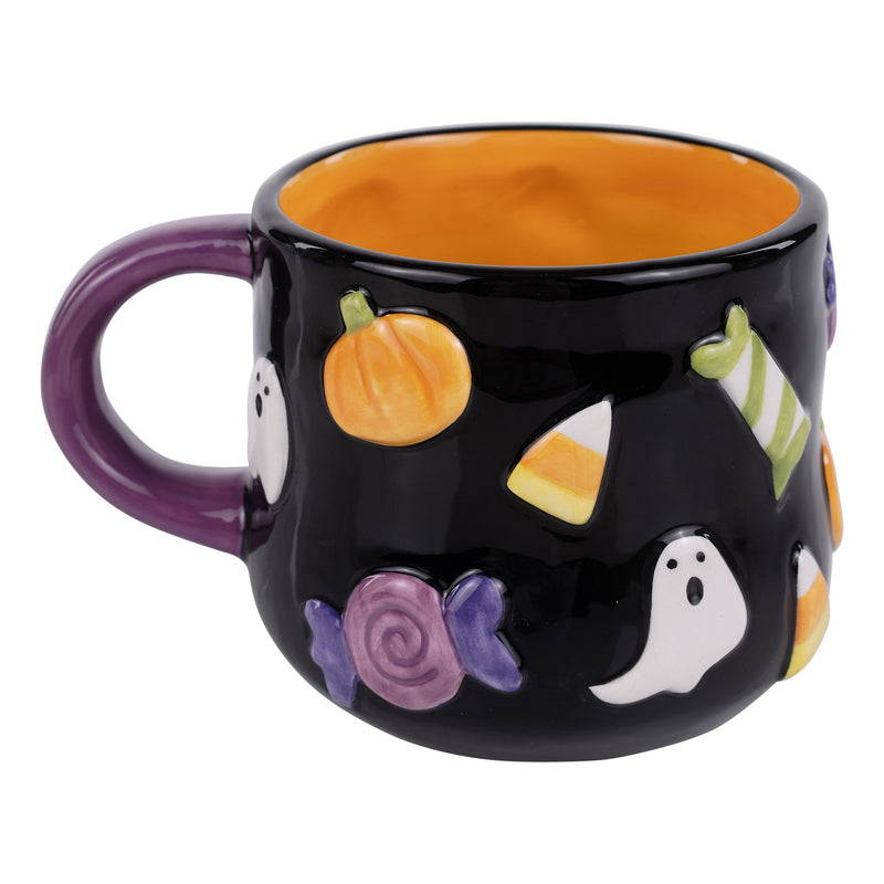Black Halloween-themed mug with pumpkins, ghosts, and candy corn on a white background