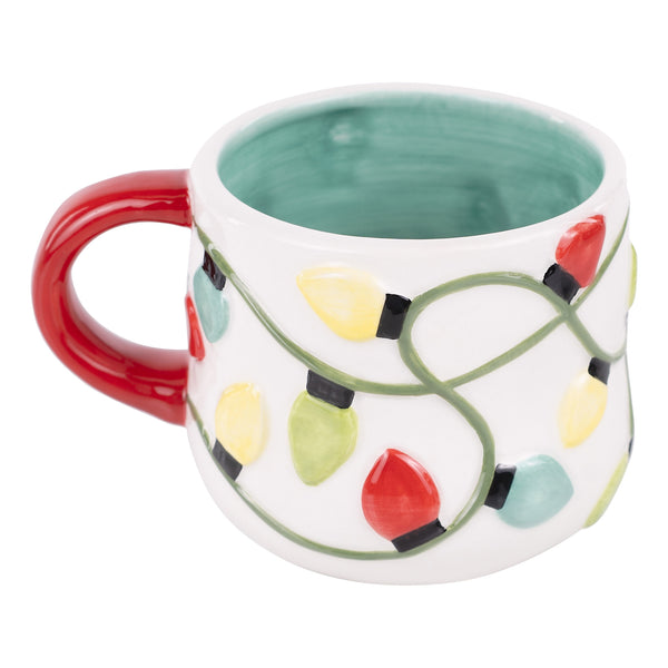Decorative mug with Christmas light design on a white background
