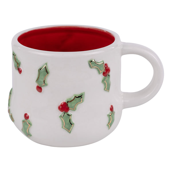White mug with holly design and red interior on a white background