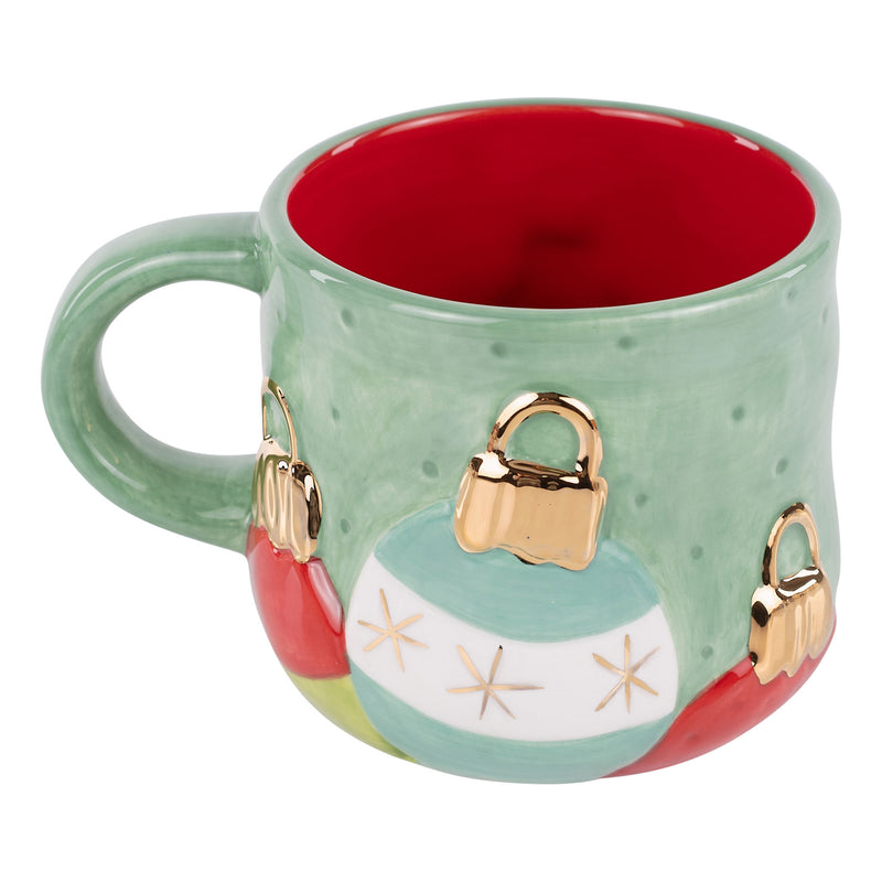 Green mug with Christmas ornament design on a white background