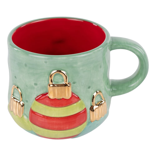 Green mug with Christmas ornament design on a white background