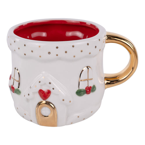 Decorative mug with a house design, gold handle, and red interior on a white background