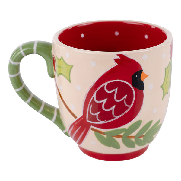Mug with a red cardinal design on a beige background