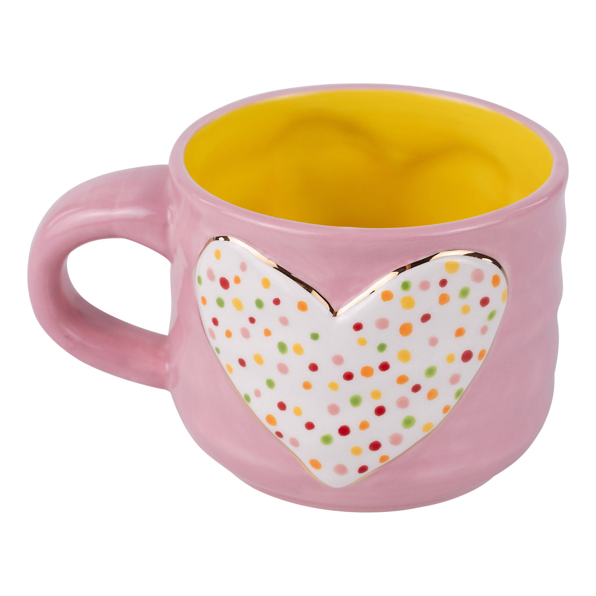Pink mug with a heart-shaped polka dot design on a white background
