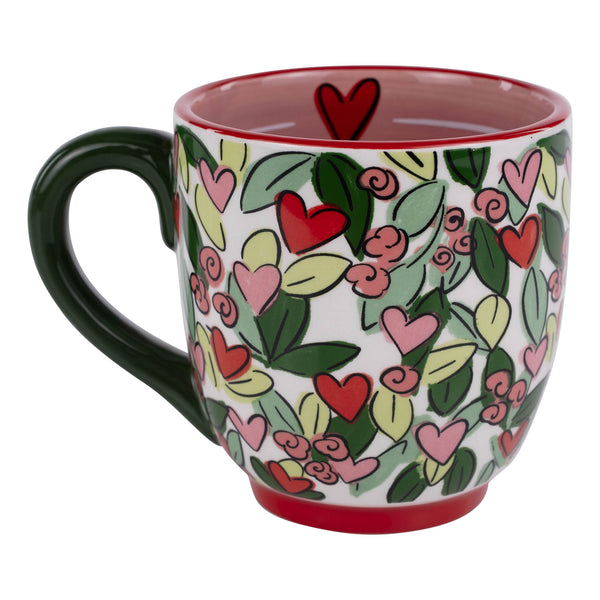 Mug with heart and leaf pattern on a white background