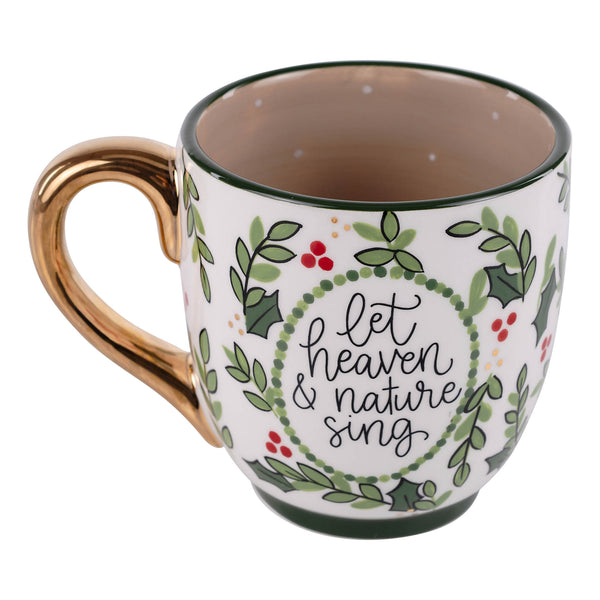 Mug with decorative design and text 'let heaven & nature sing' on a white background