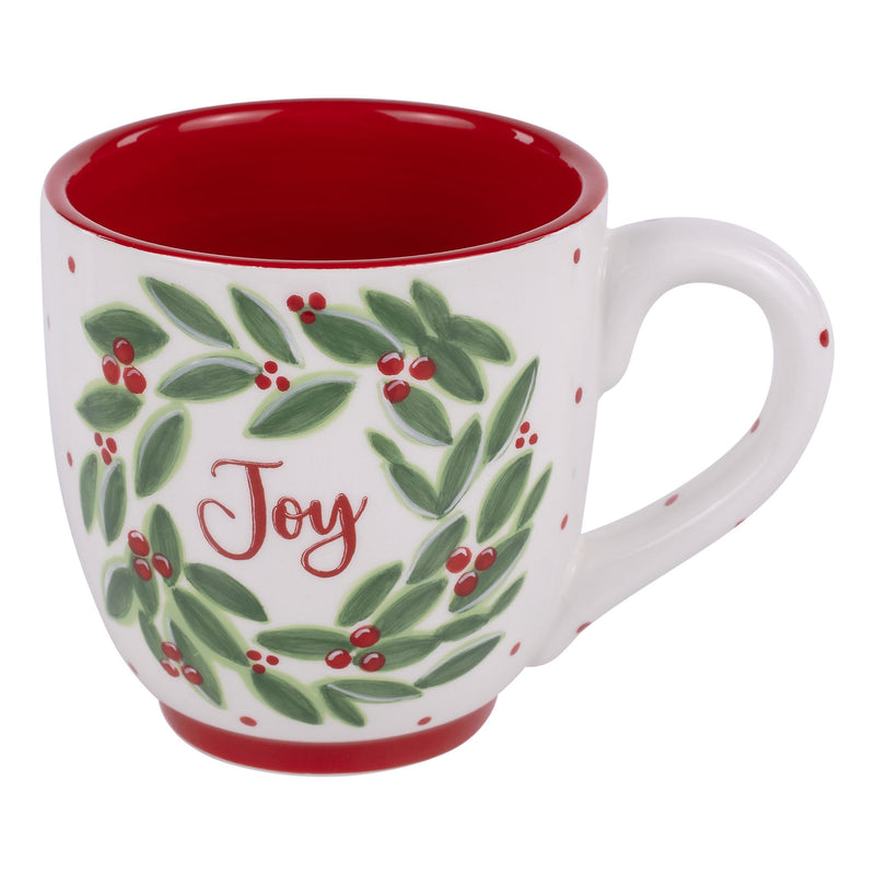 Christmas-themed mug with wreath design and 'Joy' text on a white background
