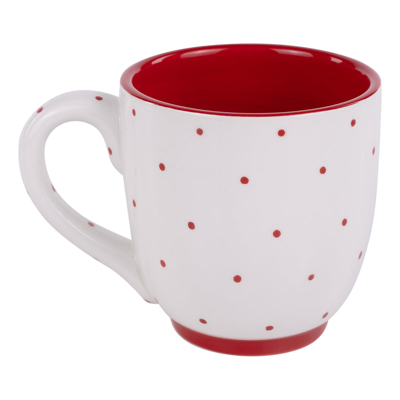 White mug with red polka dots on a white background