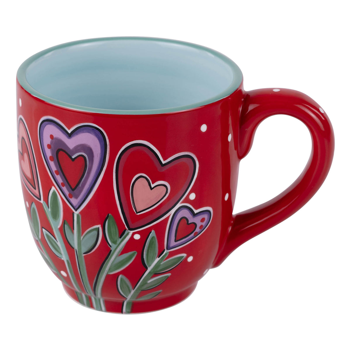 Red mug with heart designs on a white background