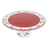 Decorative cake stand with red center and white border on a white background