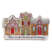 Decorative christmas house-shaped plate with colorful design on a white background