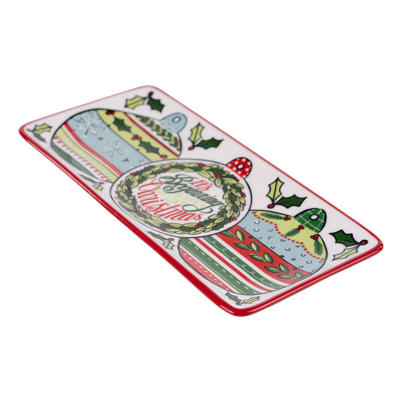 Rectangular decorative plate with Christmas-themed design on a white background