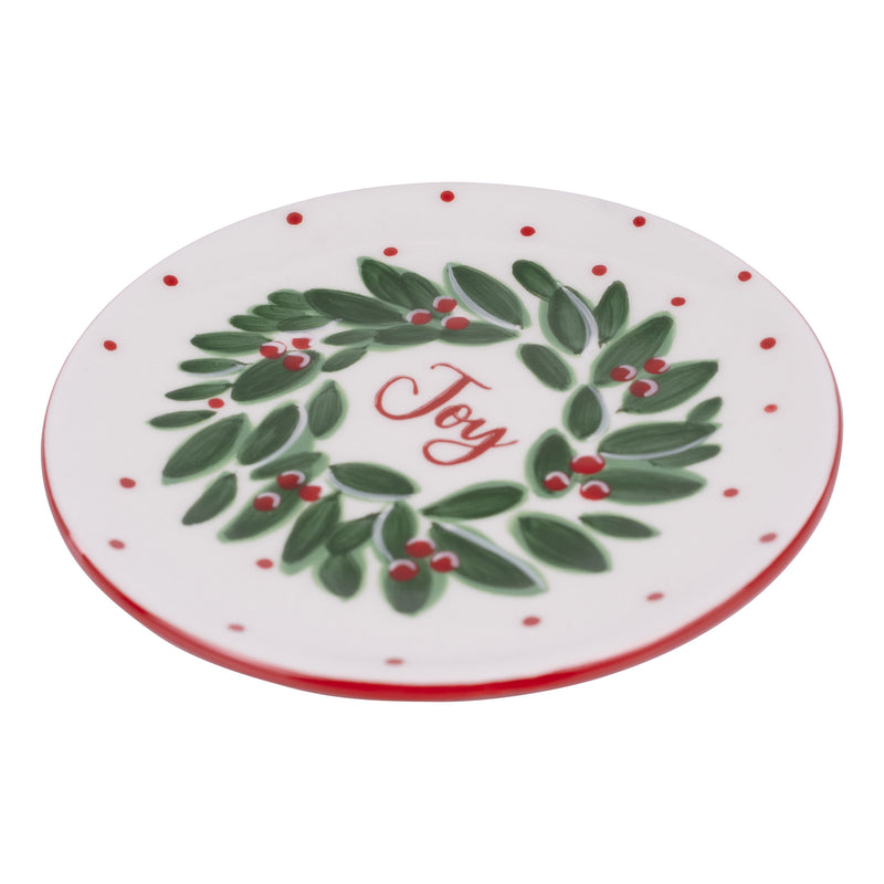 Round plate with a green wreath and 'Joy' text on a white background
