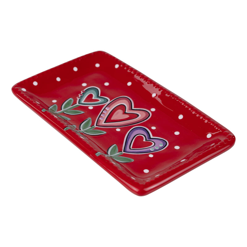 Red tray with heart designs on a white background