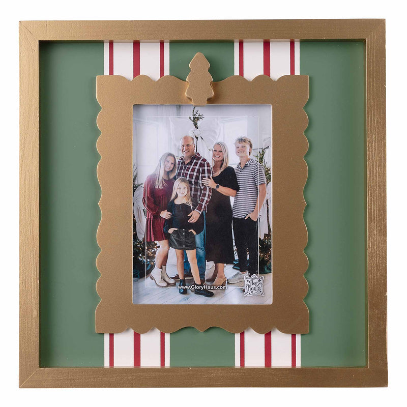 Decorative photo frame with a family photo inside, featuring a green background and red and white striped border.