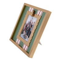 Decorative photo frame with a family photo inside, on a white background