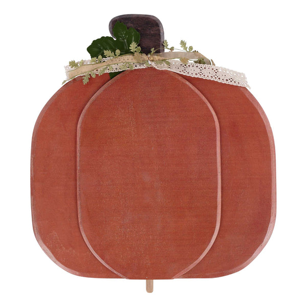Decorative pumpkin with lace and greenery on a white background
