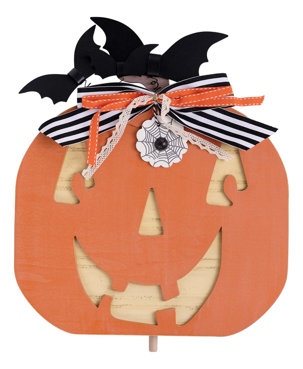 Halloween-themed decorative item with a pumpkin face, bats, and ribbons on a white background
