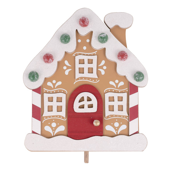 Decorative gingerbread house on a white background