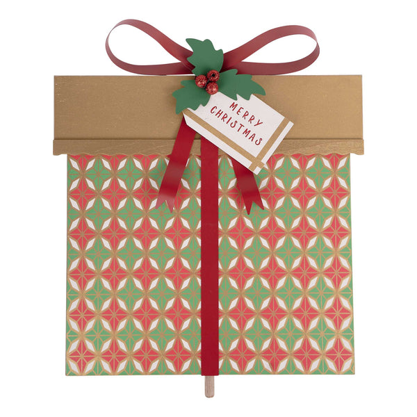 Christmas-themed gift bag with a pattern, ribbon, and 'Merry Christmas' tag on a white background.
