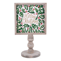 Decorative sign with 'Merry Christmas' text and holly design on a white background