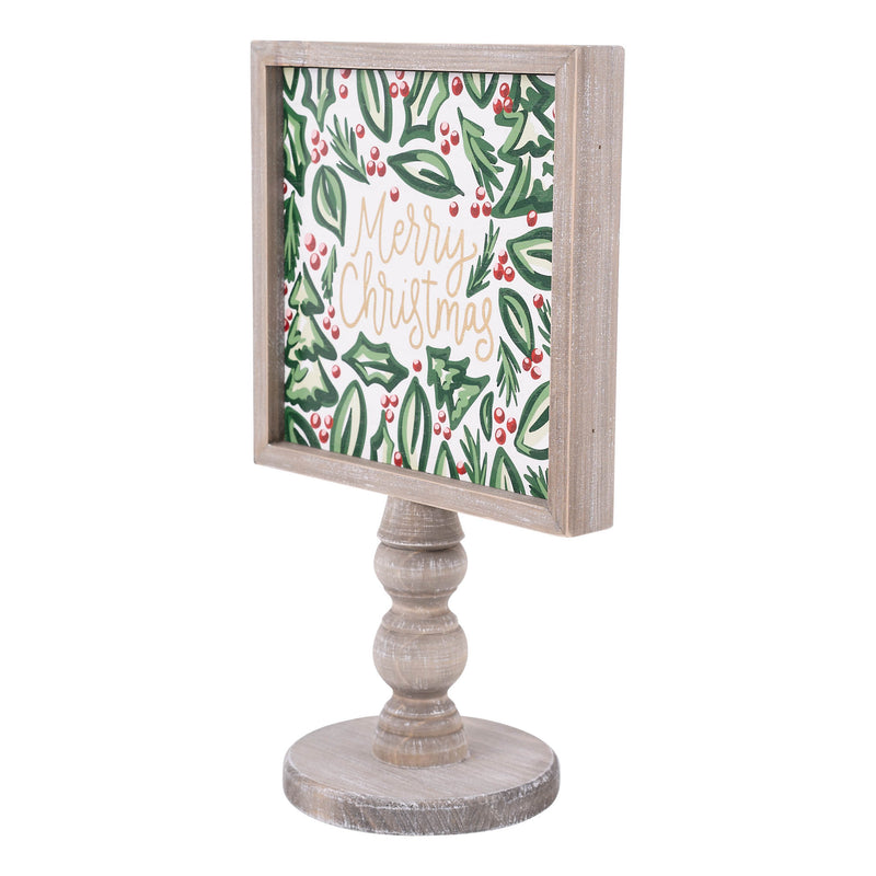 Decorative sign with 'Merry Christmas' text and holly design on a wooden stand.