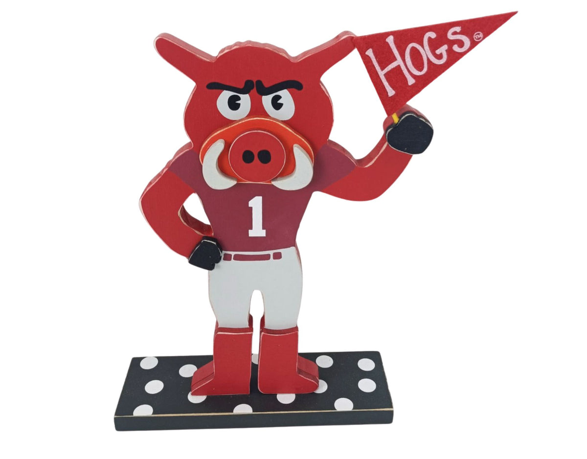 University of Arkansas tabletop décor featuring the Razorbacks mascot holding a Razorbacks flag and wearing an Arkansas jersey.