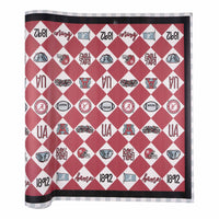 Patterned University of Alabama table runner with geometric designs on a white background