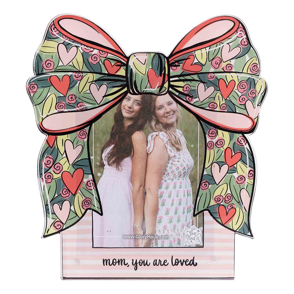 Decorative photo frame with a large bow design and two people inside, featuring the text 'mom, you are loved'.