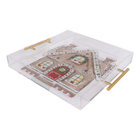 Decorative tray with gingerbread house design on a white background