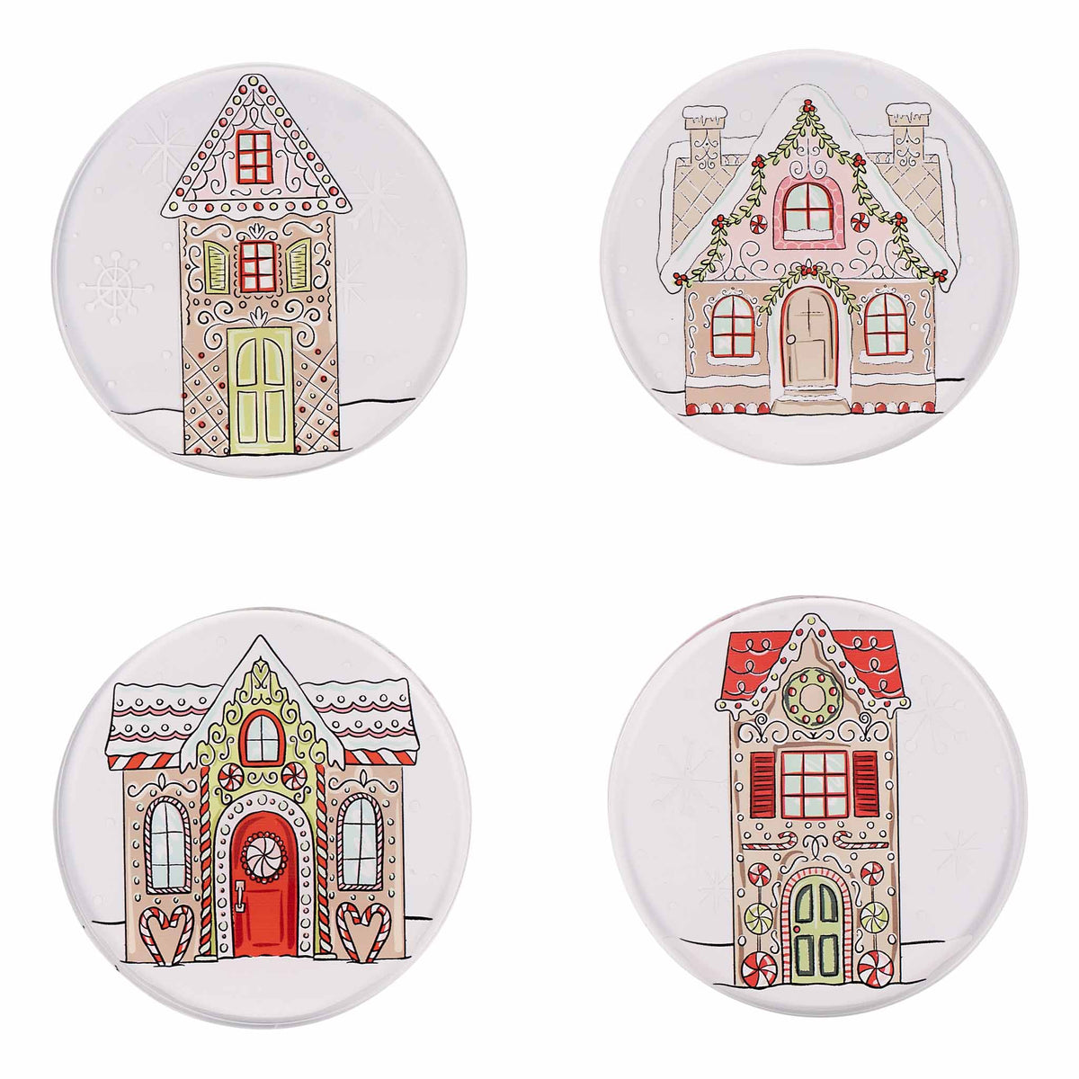 Four round ceramic coasters with gingerbread house designs on a white background