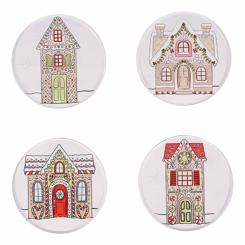 Four round ceramic coasters with gingerbread house designs on a white background