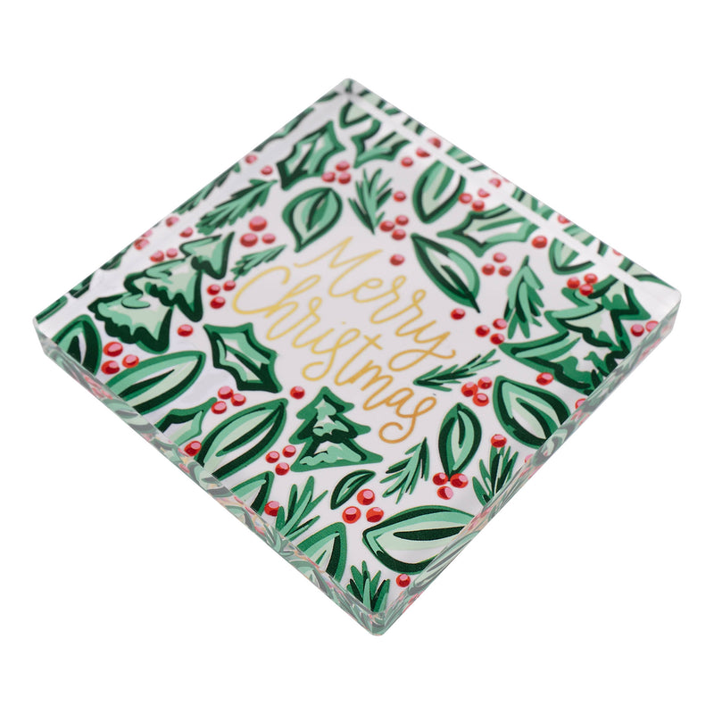 Christmas-themed napkin weight with holly leaves, berries, and 'Merry Christmas' text.