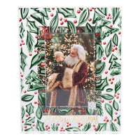 Decorative Christmas photo frame with holly design and a printed photo of Santa Claus.