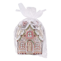 Gingerbread house-themed gift bag with decorative design on a white background