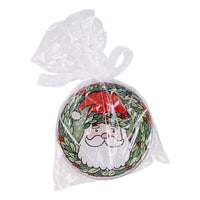 Set of four Christmas-themed coasters with decorative patterns and text.