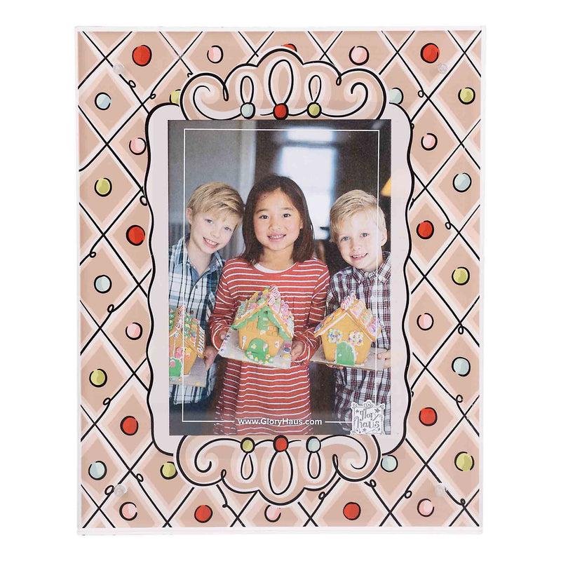 Decorative photo frame with a family holding gingerbread houses inside
